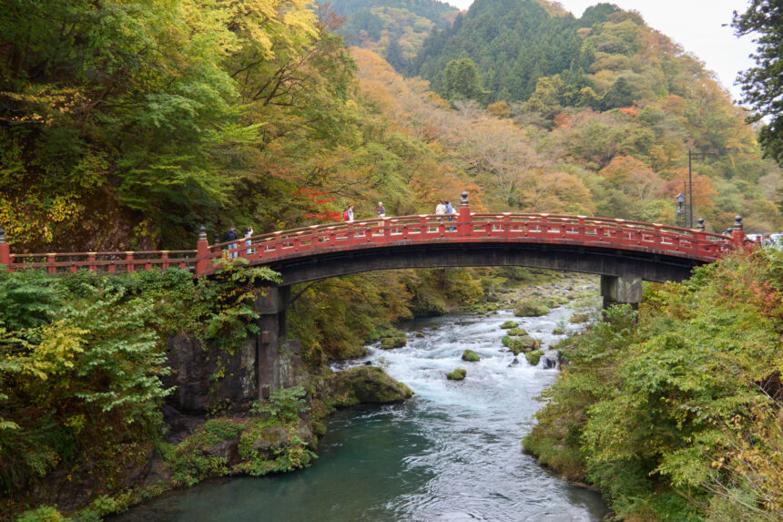 Shinkyo Bridge in Nikko with forest and river