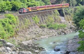 Sagano Scenic Railway train beside the Hozu River gorge in Kyoto