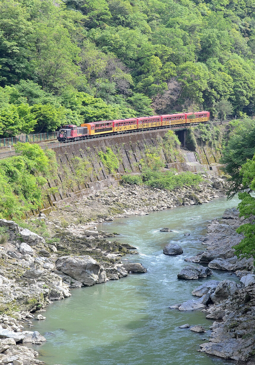 Sagano Scenic Railway train beside the Hozu River gorge in Kyoto