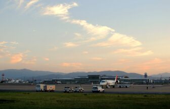 Fukuoka Airport terminal and aircraft at sunset