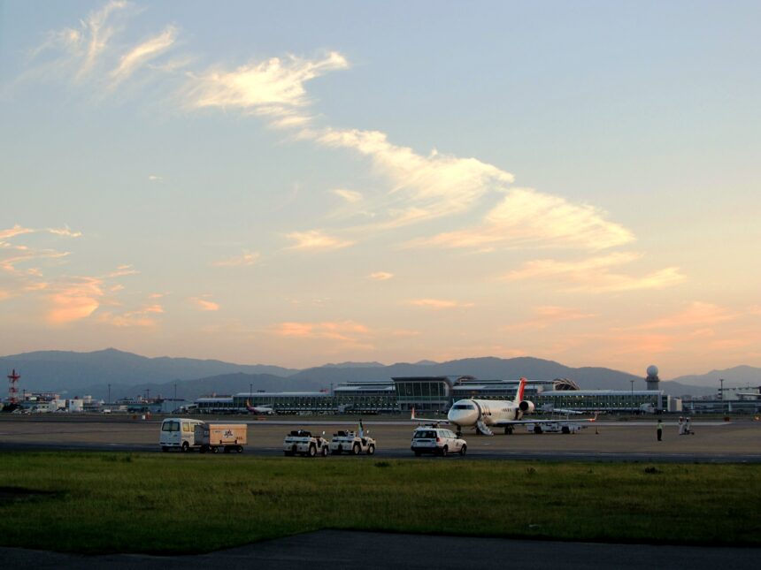 Fukuoka Airport terminal and aircraft at sunset