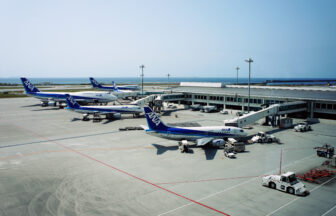 Naha Airport apron and ANA aircraft with the sea beyond