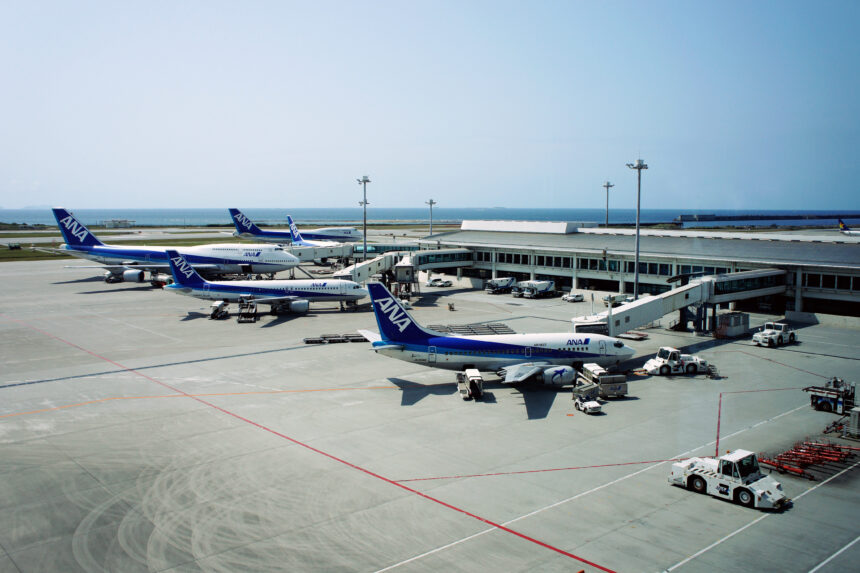 Naha Airport apron and ANA aircraft with the sea beyond