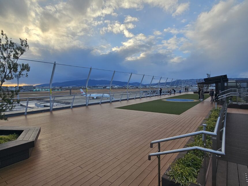 Osaka Itami Airport rooftop observation deck with runway and aircraft view
