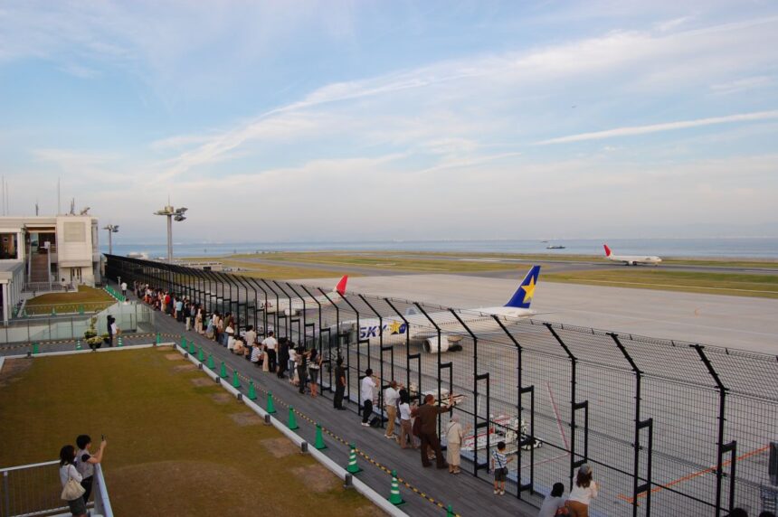 Kobe Airport observation deck with aircraft, runway, and sea view