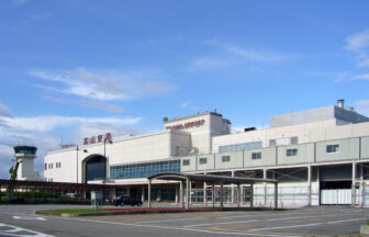 Toyama Airport terminal exterior under a blue sky