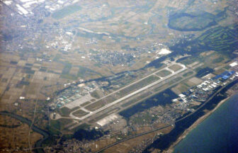 Aerial view of Komatsu Airport runway and surrounding landscape