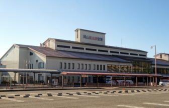 Okayama Momotaro Airport terminal exterior under a blue sky
