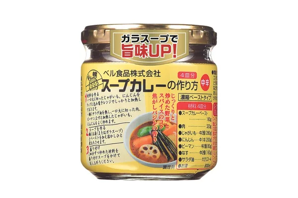 黄色いラベルの瓶。上部に「ガラスープで旨味UP！」のシールが貼られ、「スープカレーの作り方 中辛 4皿分」と書かれている