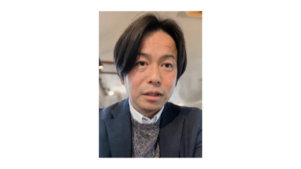 スーツ姿のJUBILATIONS事業担当 清水大輔氏