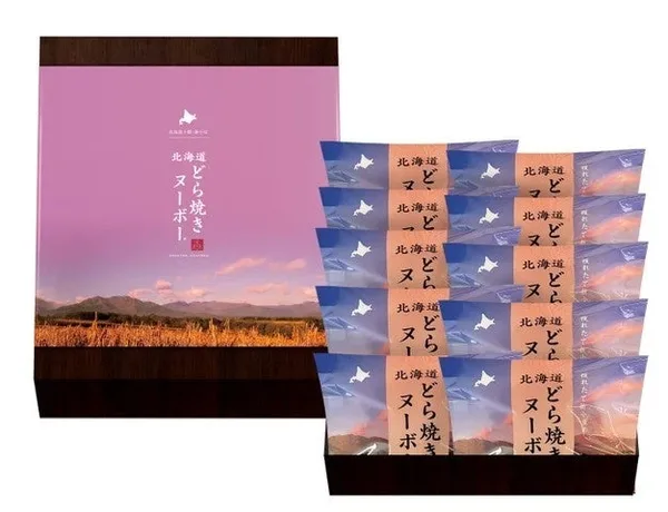 箱に並んだ10個のどら焼きと、夕景の畑を印刷した化粧箱のふた